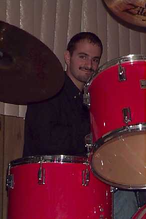 This is a picture of Chris Corso 
playing the drums